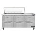 A stainless steel Continental Refrigerator with six drawers.