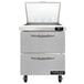 A stainless steel Continental Refrigerator with two white drawers and a clear cover.