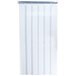 A white curtain with blue stripes hanging over a doorway.