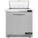 A silver Continental Refrigerator sandwich prep table with a door open.