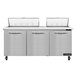 A stainless steel Continental Refrigerator with a white cutting top over three doors.