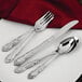 A close-up of a Walco Patrician heavy weight stainless steel salad fork.