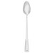 A Walco stainless steel iced tea spoon with a white handle and silver spoon on a white background.