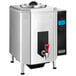 A silver Waring hot water boiler with a black handle.