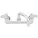 A chrome Equip by T&S wall mounted faucet with 8" adjustable centers and lever handles.