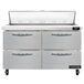 A stainless steel Continental Refrigerator with 4 drawers and a clear lid.