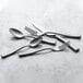 A close up of a Reserve by Libbey stainless steel dessert spoon handle.