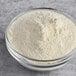 A glass bowl filled with Bob's Red Mill organic quinoa flour.