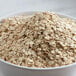 A bowl of Bob's Red Mill extra-thick whole grain rolled oats.