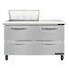 A stainless steel Continental Refrigerator with 4 drawers.