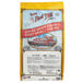 A yellow bag of Bob's Red Mill Organic Farro with a picture of a building.