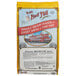 A bag of Bob's Red Mill Whole Wheat Flour on a white surface.