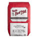 A 25-pound bag of Bob's Red Mill whole wheat flour.