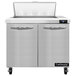 A Continental Refrigerator stainless steel 2 door refrigerated sandwich prep table on a counter.