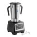 A heavy duty commercial food blender with a stainless steel 1-gallon container and black base.