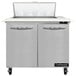 A Continental Refrigerator stainless steel 2 door cutting top sandwich prep table.