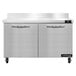 A white rectangular counter with two Continental worktop refrigerators with black doors.