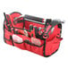 A red Olympia Tools bag with tools inside.