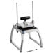 A metal and black Vollrath Vegetable Slicer on a table.