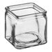 A clear square glass storage jar with a lid.