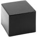 A black Delfin CR-665 Elevations pedestal cube on a white surface.