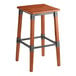 A Lancaster Table & Seating backless bar stool with a wooden seat and metal frame.