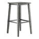 A Lancaster Table & Seating industrial bar stool with a slate gray seat and metal legs.