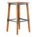 A Lancaster Table & Seating backless bar stool with a wooden seat and metal legs.