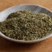 A bowl of Regal Country Chicken Seasoning on a wooden table.