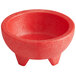 a red bowl with three legs