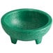 a green bowl with legs