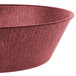 A raspberry polyethylene round basket with a handle.