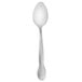 A stainless steel Walco Barclay teaspoon with a black handle.