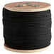 A spool of 1/8" black tie trick line rope.