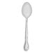 A Walco stainless steel medium weight children's teaspoon with a handle.