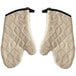 A pair of white Terry oven mitts with black trim.