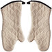 A pair of beige terry oven mitts with black steam barriers.