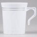 a white mug with silver stripes