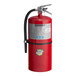 A red Buckeye fire extinguisher with a black hose and handle.