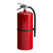 A red Buckeye fire extinguisher with a black handle.