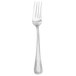 A silver Walco stainless steel dinner fork with a white background.