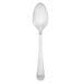 A silver Walco stainless steel teaspoon with a white handle.