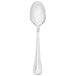 A silver Walco stainless steel dessert spoon.