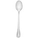 A white handle and silver bowl of a Walco stainless steel iced tea spoon.