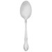 A silver spoon with a white handle.