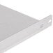 A close-up of a metal Manitowoc bin adapter shelf.