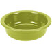 A green Fiesta serving bowl on a white surface.