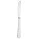 A silver Walco stainless steel dinner knife with a white handle.