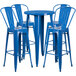 A Flash Furniture blue metal bar table with four blue stools.