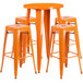 An orange metal Flash Furniture bar table with 4 square backless stools.